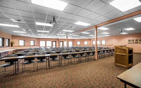 event space set up classroom style with long rows of tables and chairs