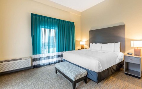 king bed and bench in suite