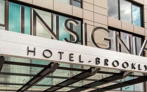 hotel exterior with insignia sign