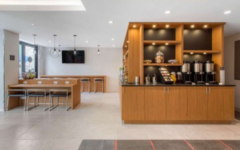 breakfast area with seating, fruit, and coffee