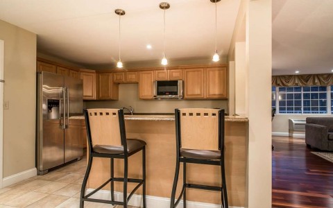 kitchen in suite with barstool seating