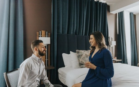 couple in hotel room talking