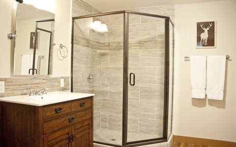 a guest bathroom with large walk-in shower