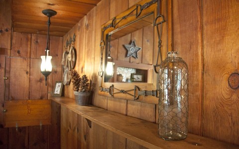 old fashioned lanterns and trinkets on the mantle