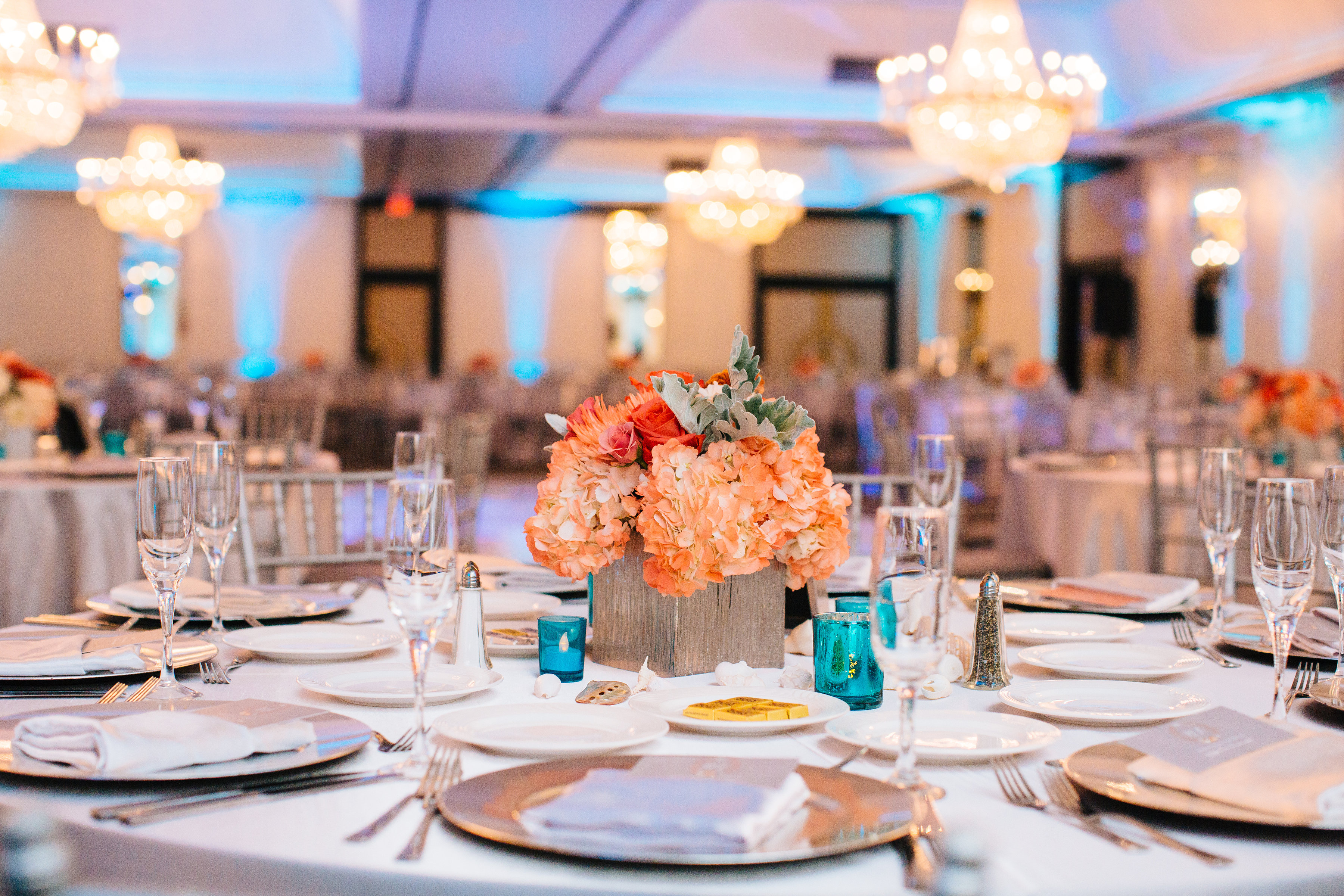 event tablescape with a peach colored floral arrangement