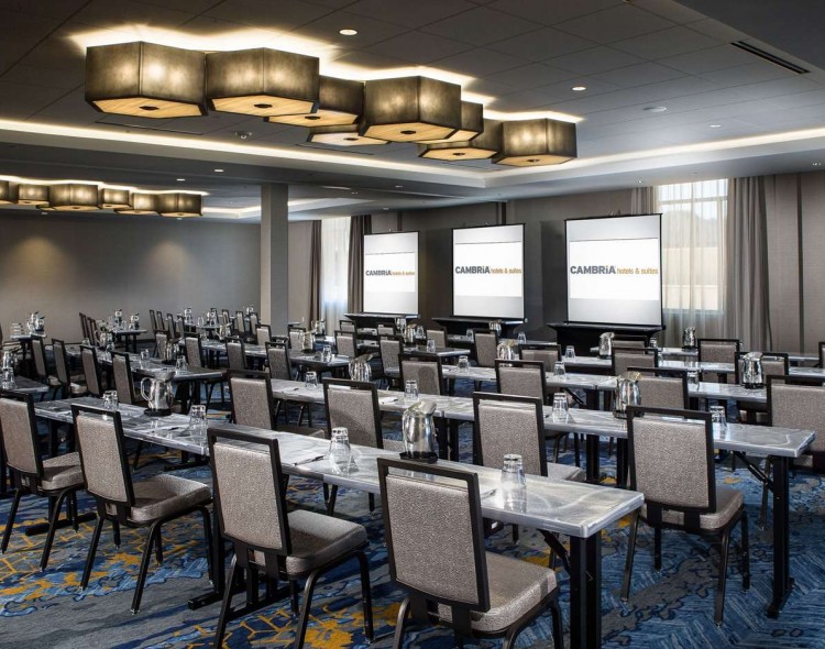 Conference Room with rows of long tables facing one direction