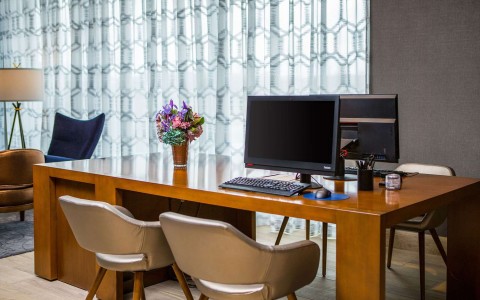 Business center with two chairs and a desktop