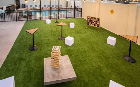 Pool area with backyard games