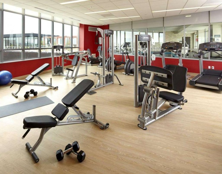 fitness center with cardio and weight equipment