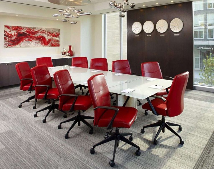 meeting room with conference table and red chairs