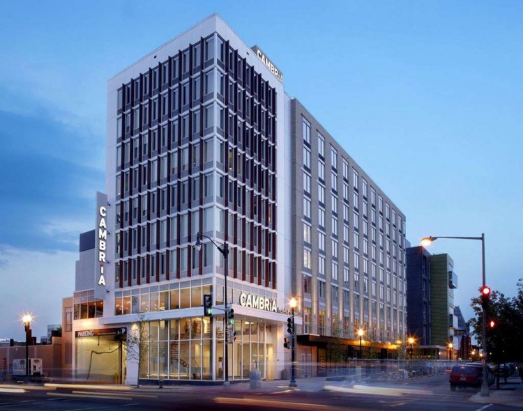 exterior of hotel on street corner at dusk