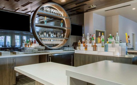 Hotel bar with tiered liquor bottles