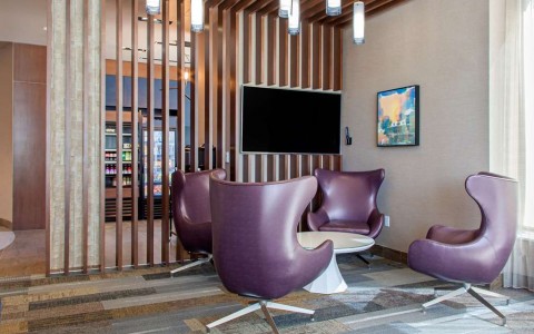 Hotel lobby with four purple chairs