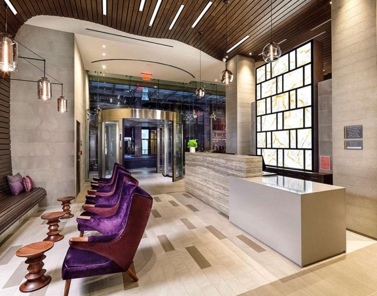 Hotel lobby with check-in desk and and seating