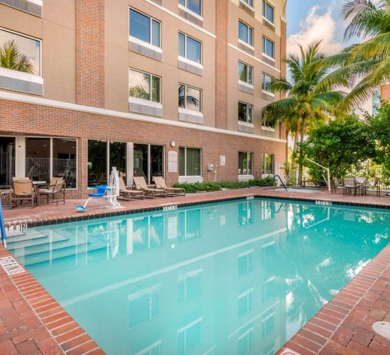Outdoor pool with lounge seating