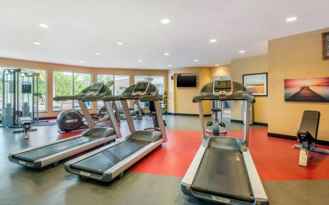 Exercise room with cardio equipment and weights