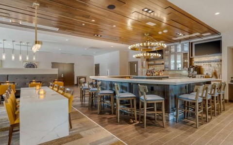 Hotel bar with yellow and gray chairs