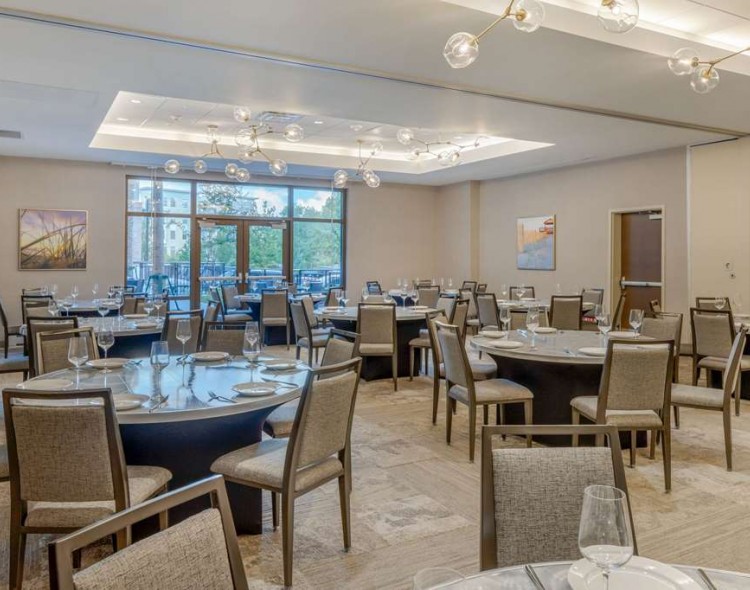 round meeting tables in a room with blue flowers