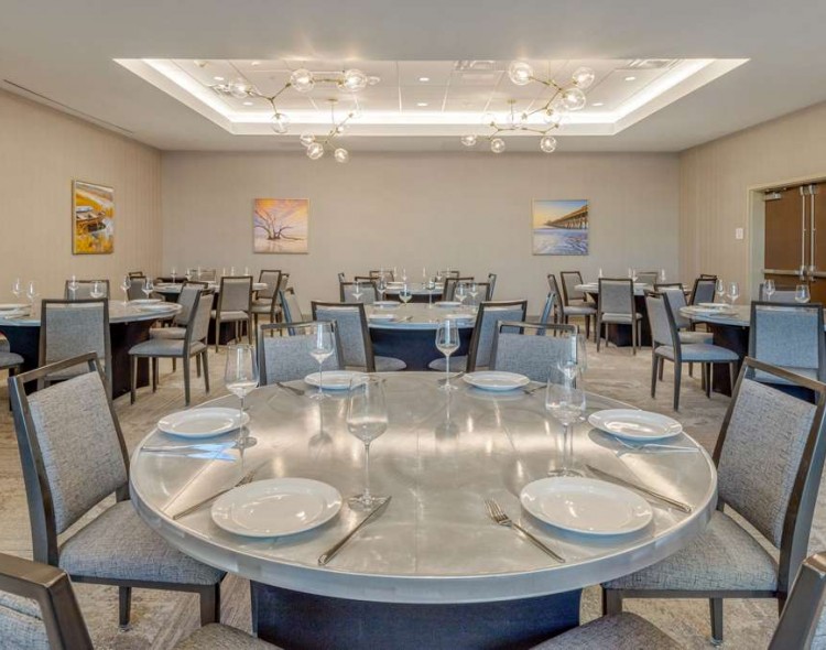 round meeting tables in a room with blue flowers