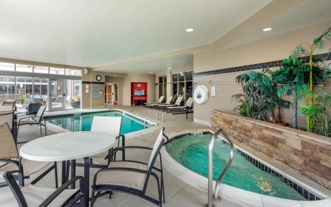 Indoor hot tub and pool with seating