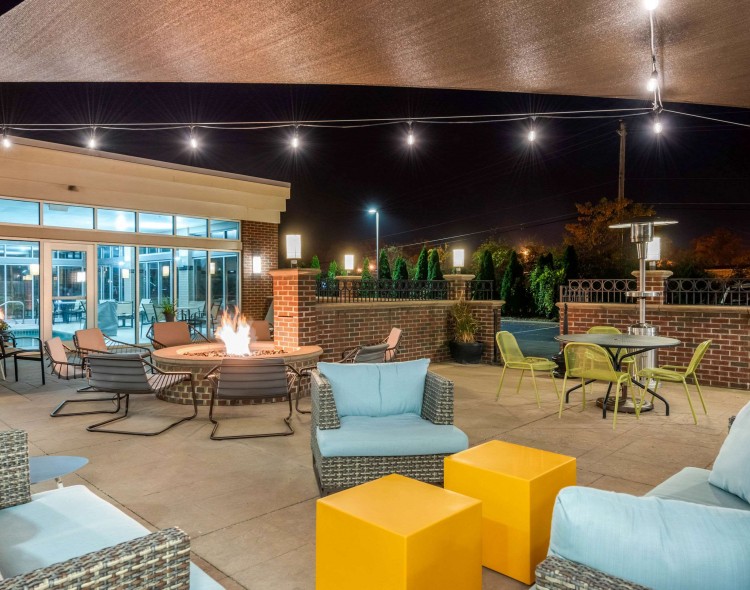 Outdoor patio with seating and a fire pit