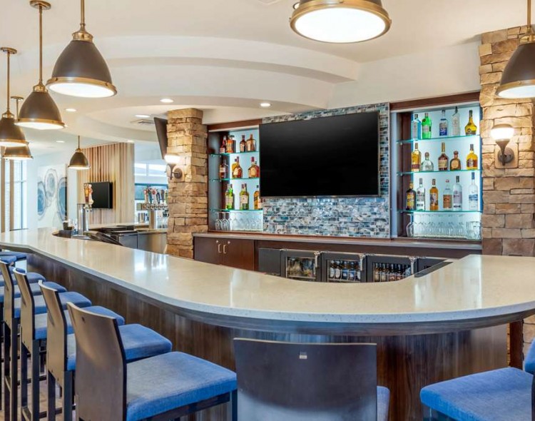Hotel bar with seating and tv