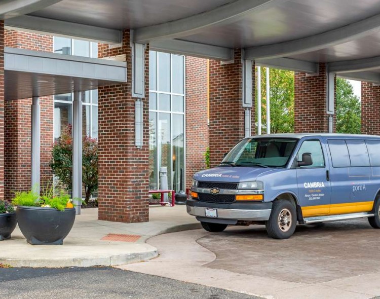 transportation shuttle van outside of hotel entrance
