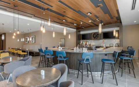 Hotel bar with blue barstools