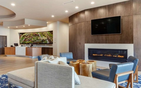 Hotel lobby with multiple lights and fireplace