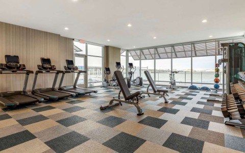 Exercise room with cardio equipment and weights