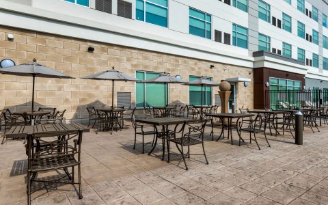outdoor patio with seating and table umbrellas