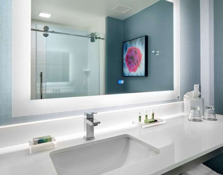 bathroom with lighted vanity mirror