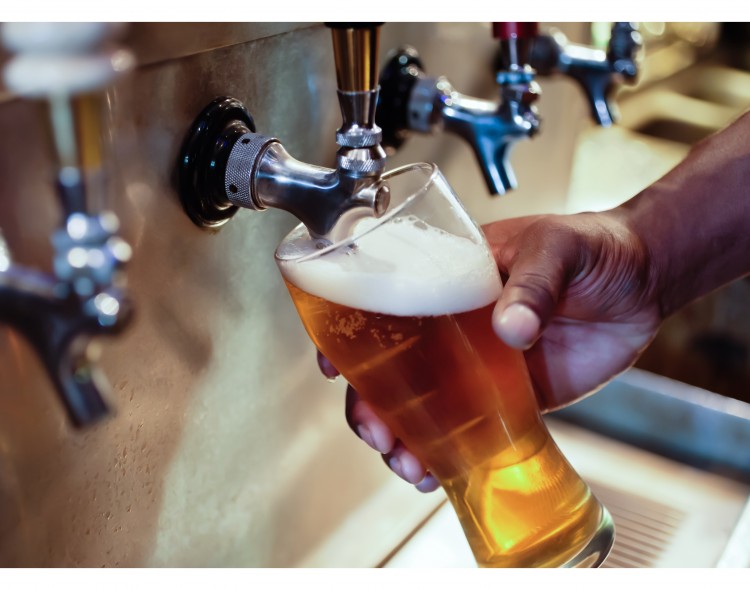 beer being poured from tap
