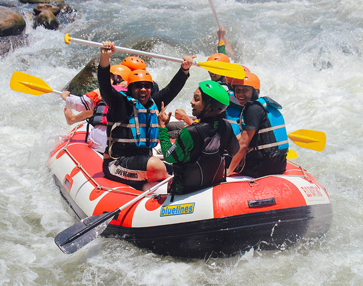 group of people white water rafting