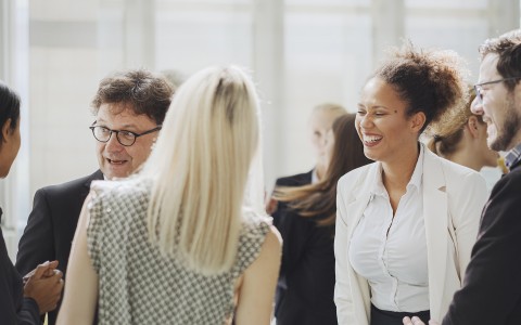 colleagues standing around and mingling
