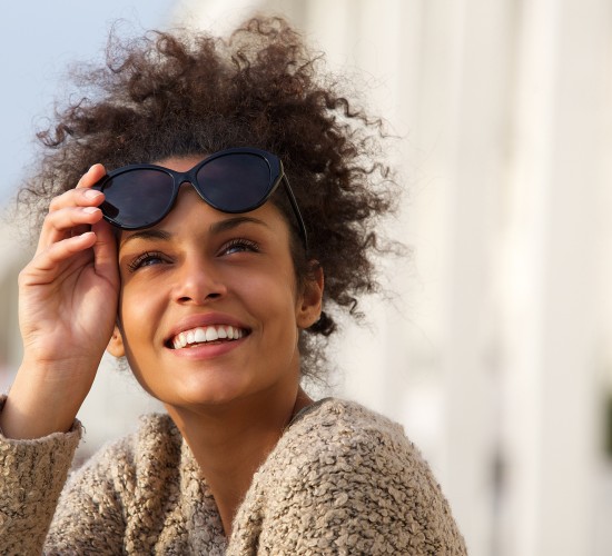 woman took her sunglasses off to see something far away