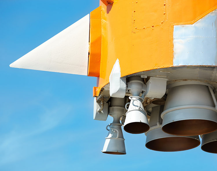 a yellow part of a space ship in the air