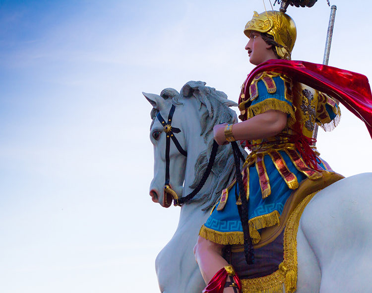 a medieval soldier ontop of a horse