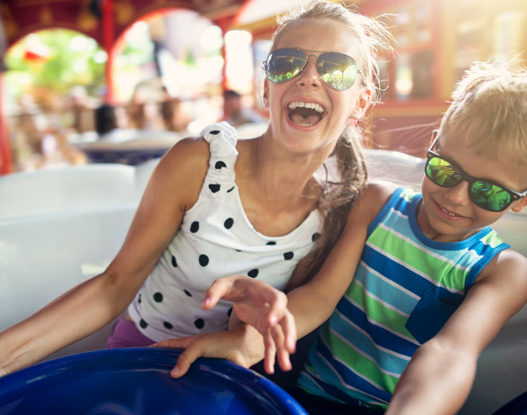 kids on an amusement ride laughing