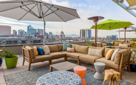 rooftop deck with brown lounge chairs