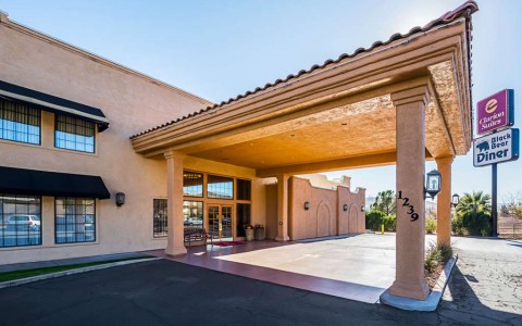 exterior of hotel entrance with long awning 