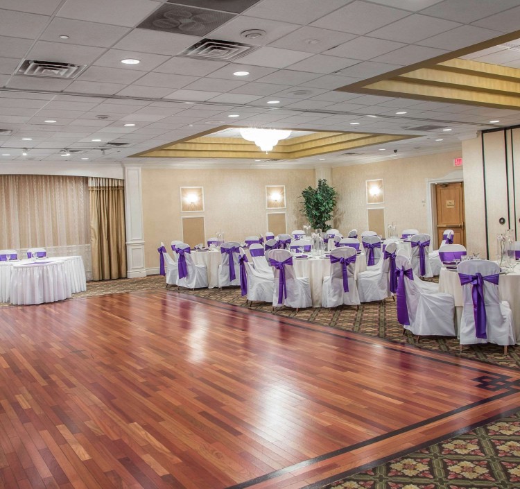 Ballroom with dance floor and banquet tables