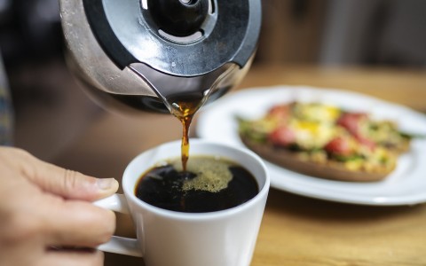 coffee being poured into a mug