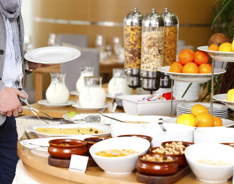 breakfast buffet spread with fruits and cereals
