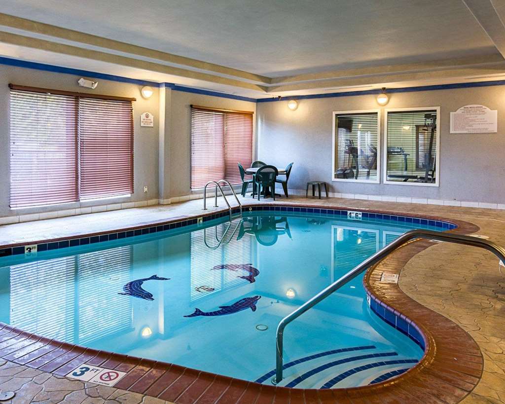 Indoor pool with a table and four chairs