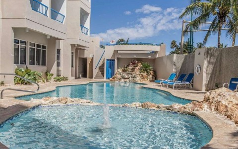 Outdoor pool with hot tub and fountain