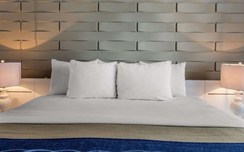 close up image of king bed with headboard