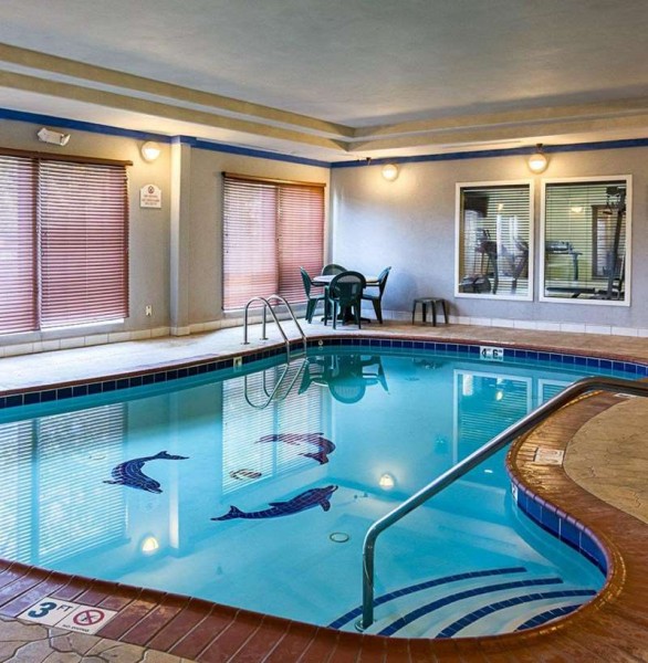 Indoor pool with a table and four chairs