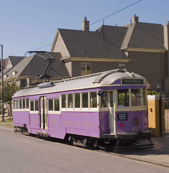 purple trolley on the road