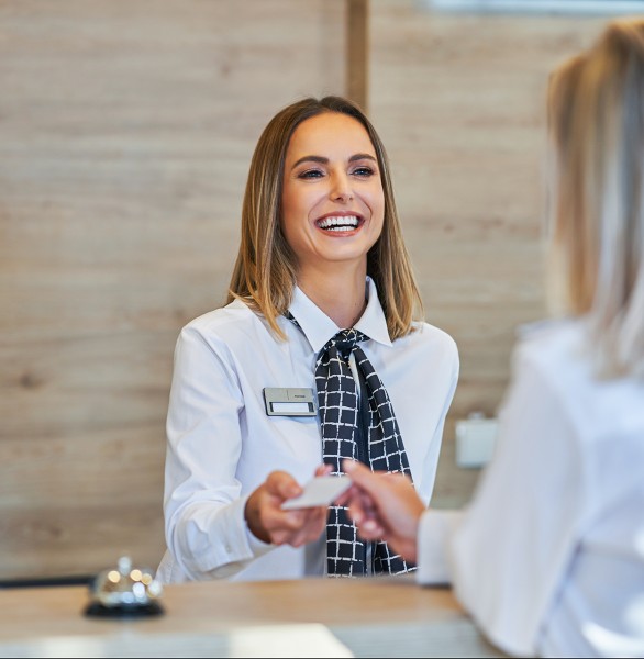 woman checking guest in